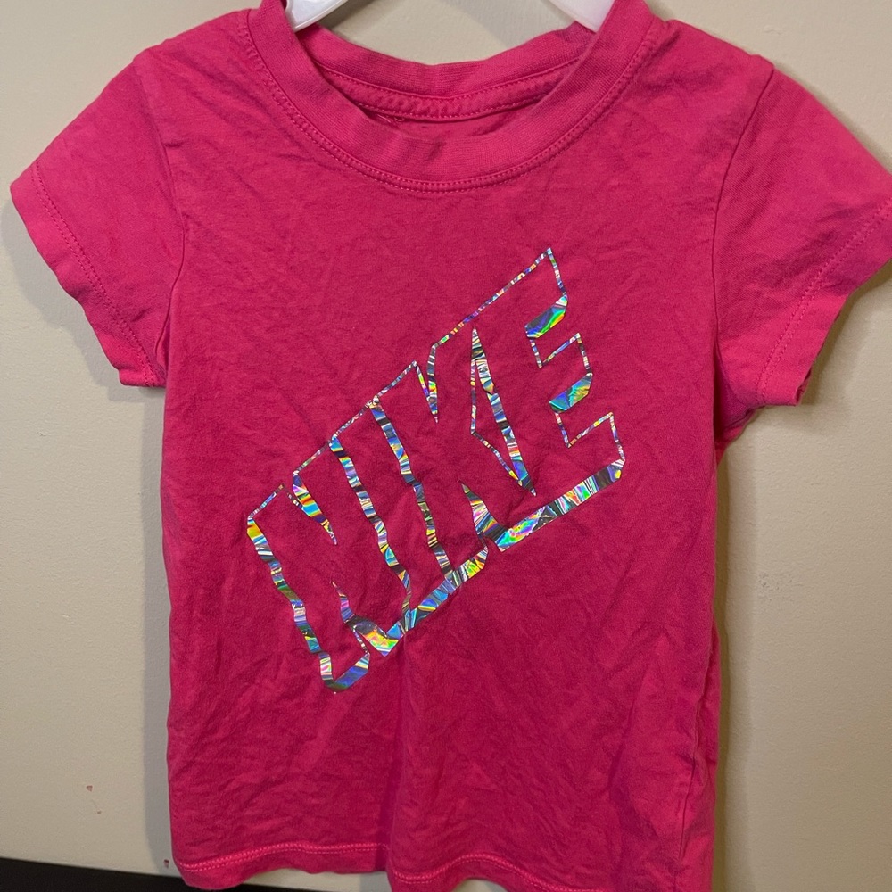 Nike T-Shirt.  Pink with the Nike Logo in shiny silver.